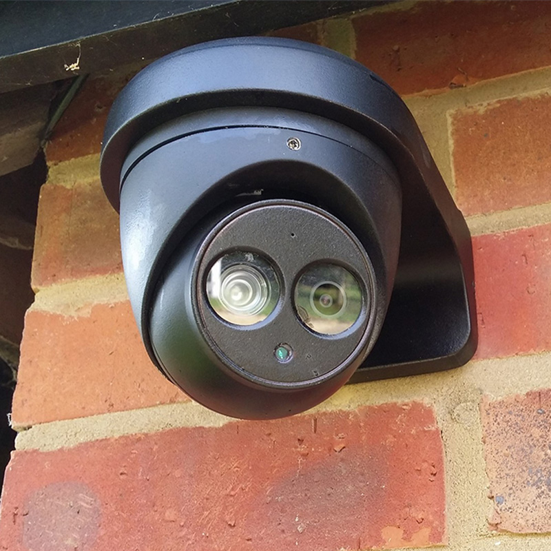 cctv camera attached to a wall